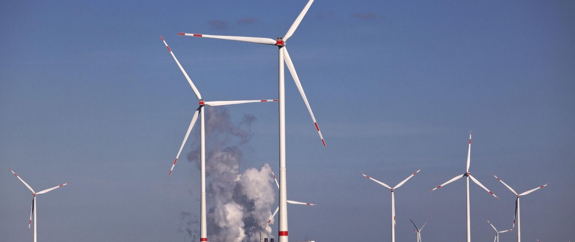 Wind turbines at the Garzweiler open-cast lignite mine. In the background: the Neurath power plant, North Rhine-Westphalia.