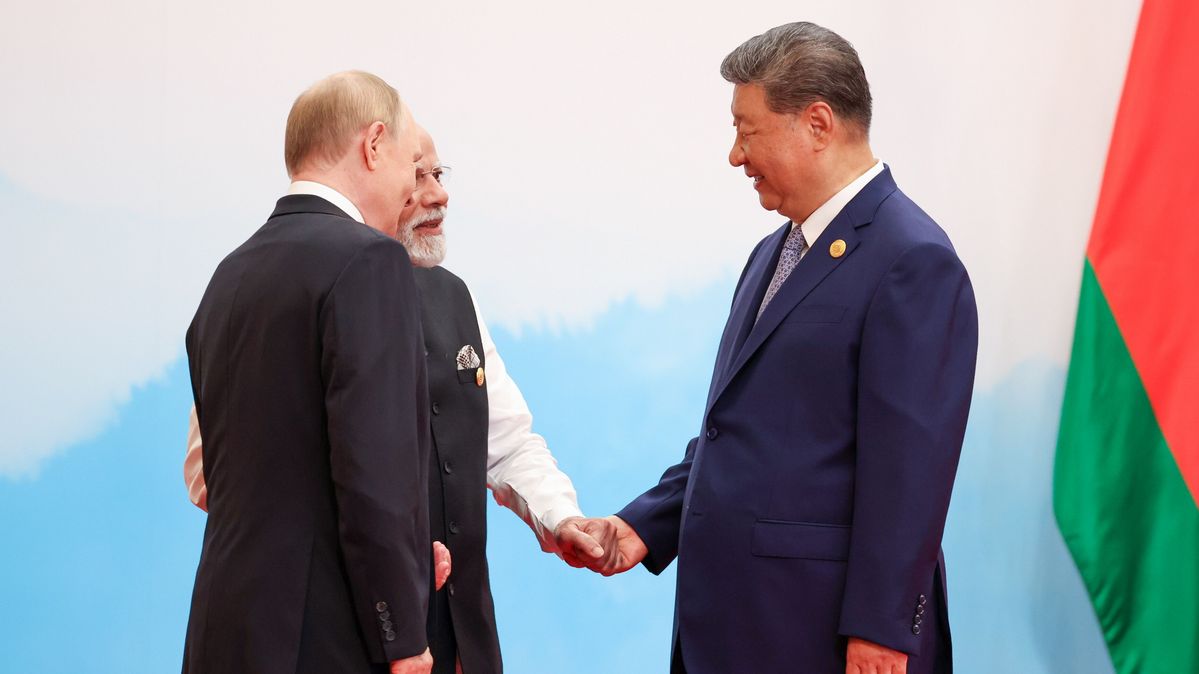Vladimir Putin, Xi Jinping, and Narendra Modi at the 2025 SCO Summit Three politicians shake hands